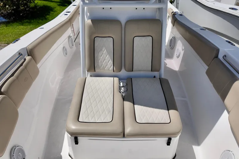 Slide: The Image of 2017 Sea Fox 288 Commander boat interior with beige cushioned seating. - 17