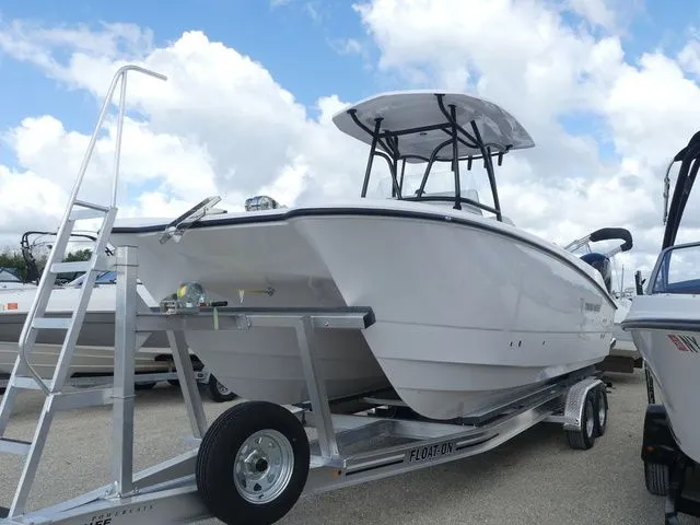 The Image of Twin Vee 240 GFX2 2027 on trailer under blue sky. - 1