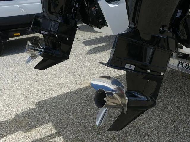 Slide: The Image of Twin Vee 240 GFX2 2027 outboard motors with shiny propellers. - 11