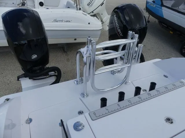 Slide: The Image of Twin Vee 240 GFX2 2027 with Mercury engines and fishing rod holders. - 13