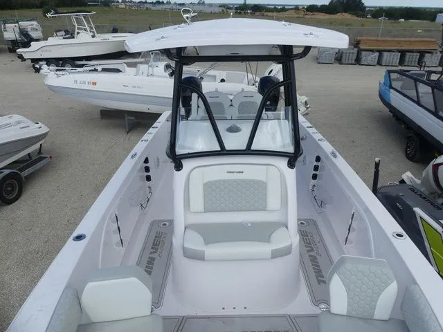 Slide: The Image of 2027 Twin Vee 240 GFX2 boat in a parking area. - 21