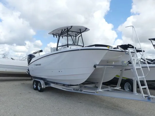 Slide: The Image of 2027 Twin Vee 240 GFX2 boat on trailer, side view. - 3