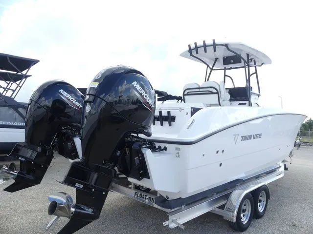 Slide: The Image of 2027 Twin Vee 240 GFX2 boat with dual Mercury engines on trailer. - 4