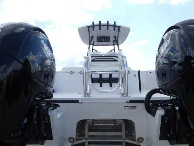 Slide: The Image of Rear view of Twin Vee 240 GFX2 boat, 2027 model, featuring dual Mercury engines. - 5