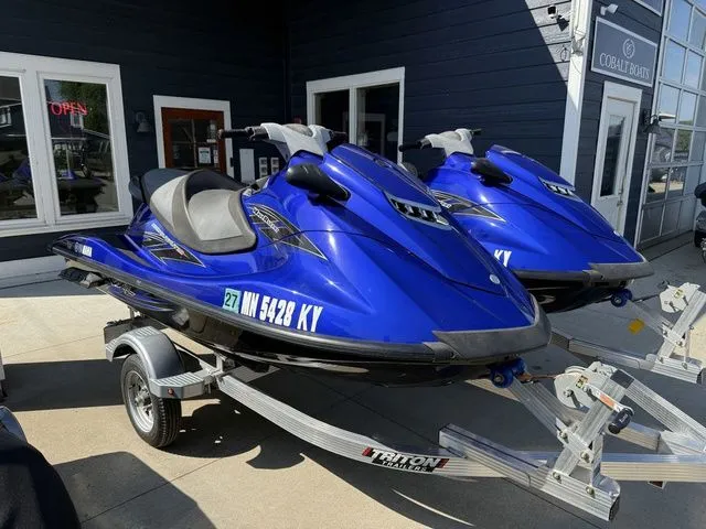 The Image of Two blue 2013 Yamaha WaveRunner VX jet skis on trailer. - 1
