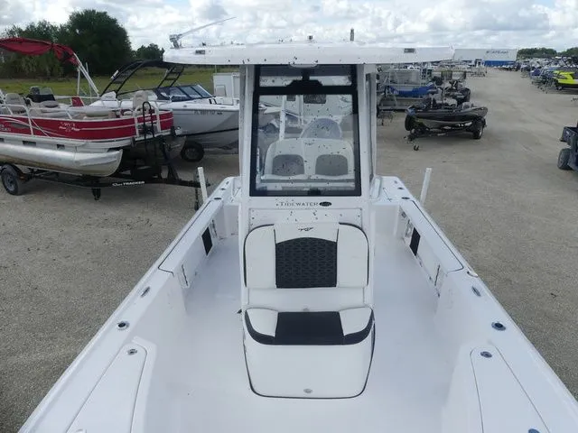 Slide: The Image of 2025 Tidewater 2410 Bay Max boat in a parking lot. - 14
