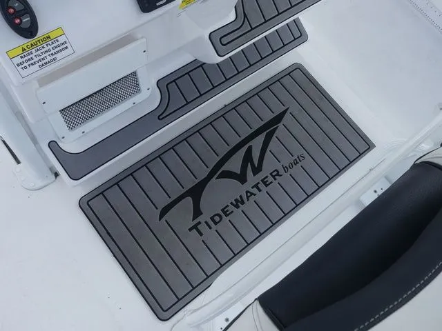 Slide: The Image of Tidewater 2410 Bay Max 2025 boat floor with logo. - 19