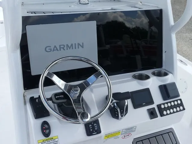 Slide: The Image of 2025 Tidewater 2410 Bay Max boat console with Garmin display. - 21