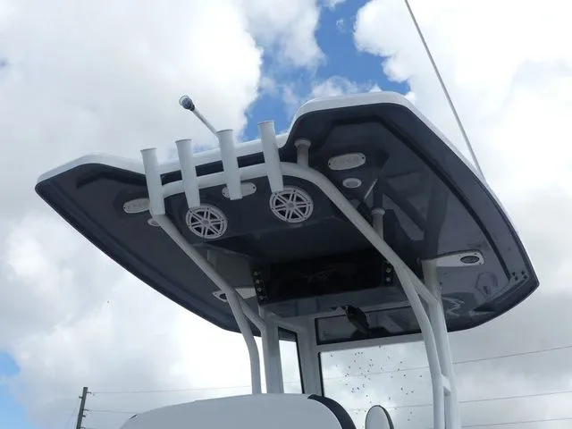 Slide: The Image of Tidewater 2410 Bay Max 2025 boat roof with speakers and rod holders. - 24
