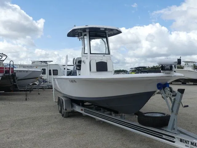 Slide: The Image of 2025 Tidewater 2410 Bay Max boat on trailer, cloudy sky. - 3