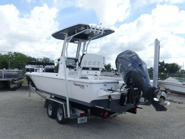 Slide: The Image of 2025 Tidewater 2410 Bay Max boat with outboard motor. - 6