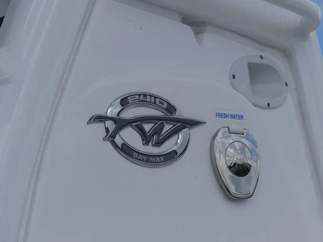 Slide: The Image of Tidewater 2410 Bay Max 2025 boat emblem and freshwater connection. - 8