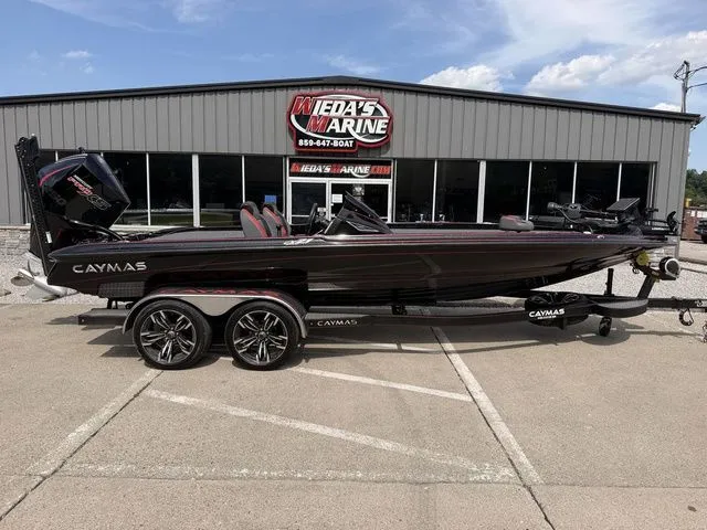 The Image of 2023 Caymas CX 21 PRO boat in front of dealership building. - 1