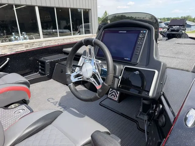 Slide: The Image of Interior view of 2023 Caymas CX 21 PRO boat with steering console. - 7