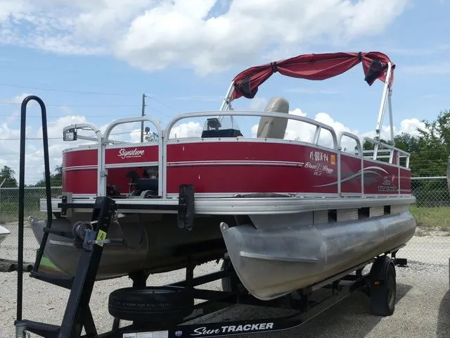 The Image of 2015 Sun Tracker Bass Buggy 18 DLX pontoon boat on trailer. - 1