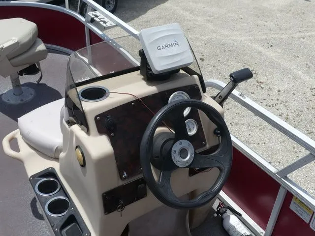 Slide: The Image of 2015 Sun Tracker Bass Buggy 18 DLX helm with Garmin device. - 17