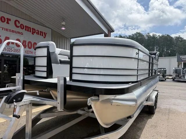 Slide: The Image of 2026 Veranda VV 22RC pontoon boat on trailer outside store. - 14