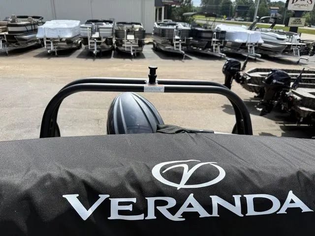 Slide: The Image of Veranda VV 22RC 2026 pontoon boat in a parking lot. - 22