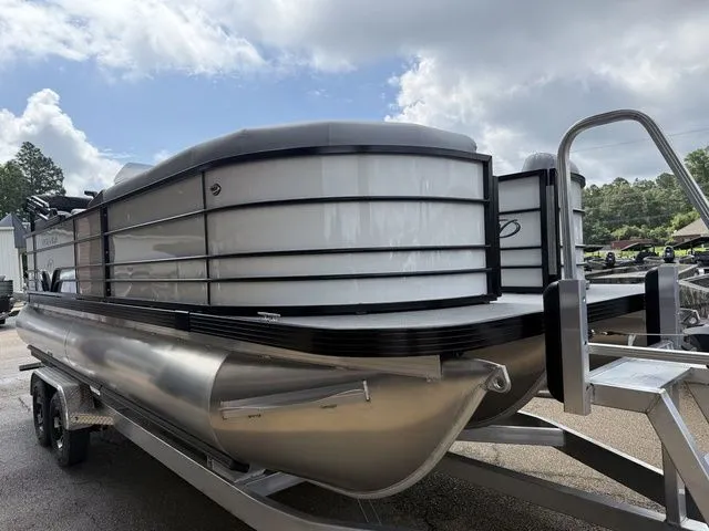 Slide: The Image of 2026 Veranda VV 22RC pontoon boat on trailer under cloudy sky. - 3