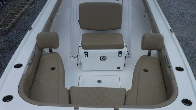 Slide: The Image of Interior of 2026 Blazer Bay 2440 boat with beige seating. - 12