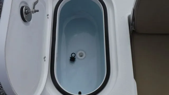 Slide: The Image of Blazer Bay 2440 2026 boat livewell with drain and seating. - 16