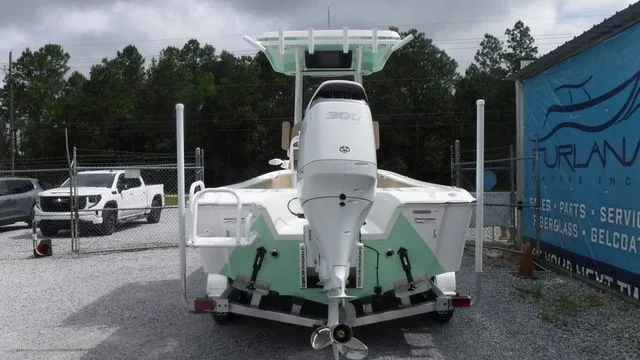 Slide: The Image of 2026 Blazer Bay 2440 boat with outboard motor on trailer. - 3