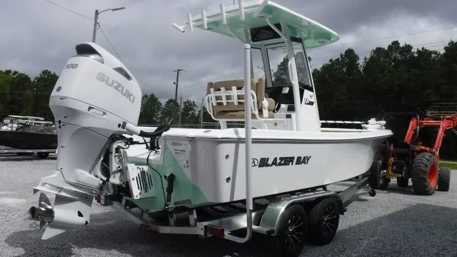 Slide: The Image of 2026 Blazer Bay 2440 boat with Suzuki engine on trailer. - 4