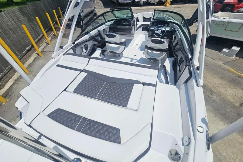 Slide: The Image of 2024 Monterey 215SS Super Sport boat interior with sleek seating and modern dashboard design. - 10