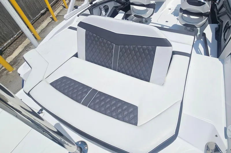 Slide: The Image of 2024 Monterey 215SS Super Sport boat interior with stylish, diamond-stitched seating. - 11