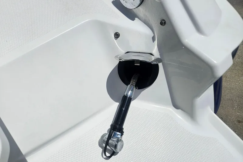 Slide: The Image of 2024 Monterey 215SS Super Sport boat fuel filler cap and nozzle detail. - 12