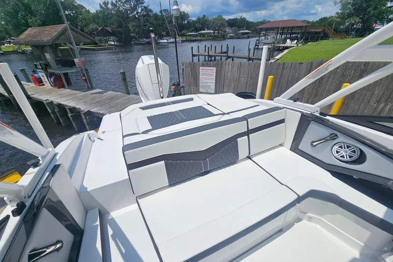 Slide: The Image of 2024 Monterey 215SS Super Sport boat interior at a dockside location. - 13