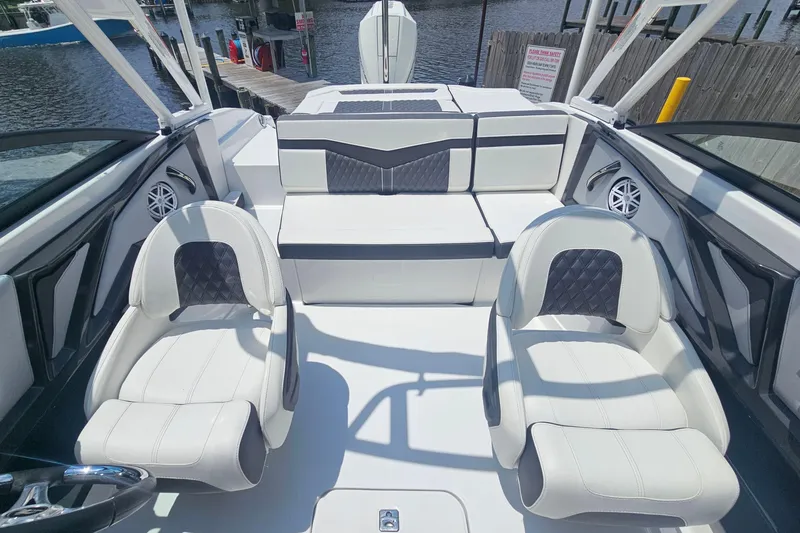 Slide: The Image of 2024 Monterey 215SS Super Sport boat interior with white seating and modern design. - 15