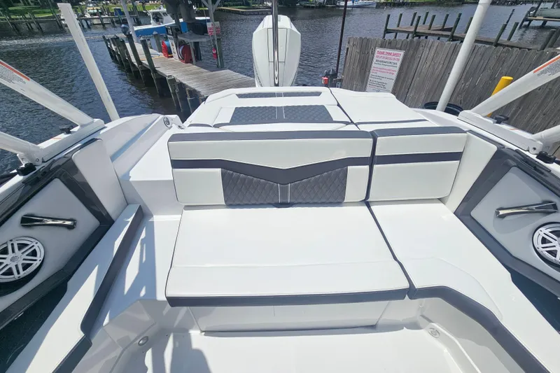 Slide: The Image of 2024 Monterey 215SS Super Sport boat interior with sleek seating and waterfront view. - 16