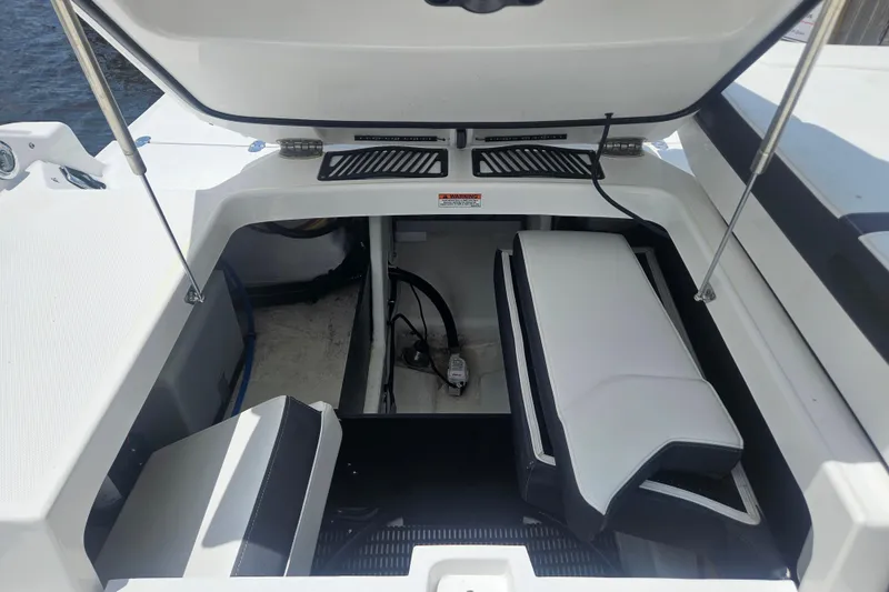 Slide: The Image of Open engine compartment of 2024 Monterey 215SS Super Sport boat, showcasing interior details. - 18
