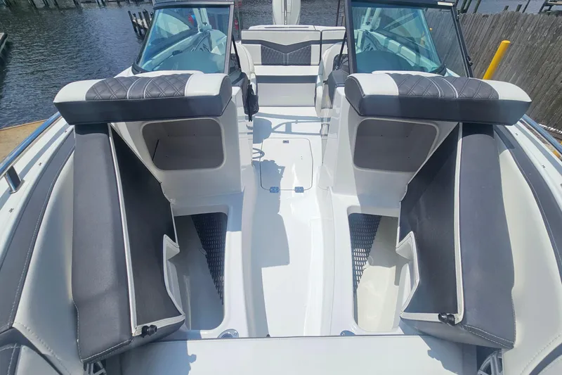 Slide: The Image of 2024 Monterey 215SS Super Sport boat interior with sleek seating and modern design. - 23