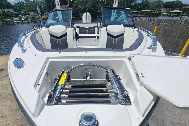 Slide: The Image of 2024 Monterey 215SS Super Sport boat with open bow seating and storage compartment. - 8