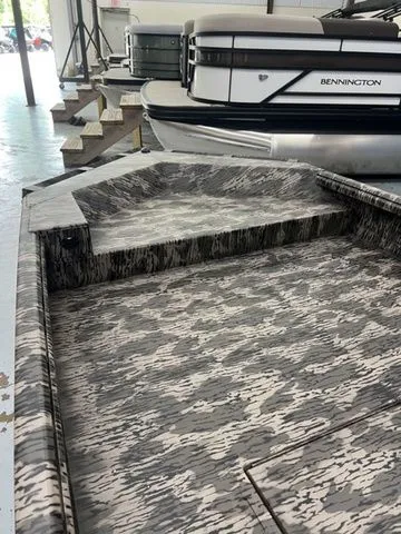 Slide: The Image of Reaper 756 Timber Reaper 2026 boat with camouflage pattern in showroom. - 5