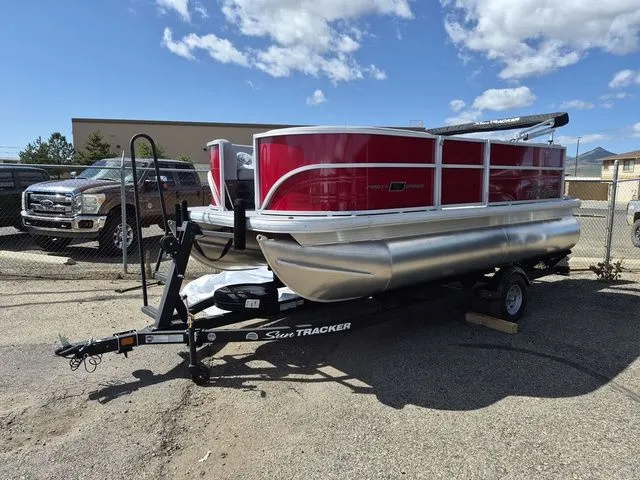 The Image of 2026 Sun Tracker Party Barge 16 DLX on trailer, red design. - 1