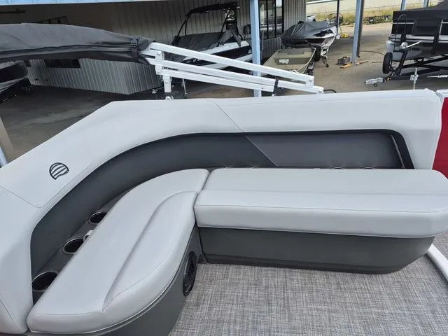 Slide: The Image of Interior of Sun Tracker Party Barge 16 DLX 2026 with gray seating. - 14