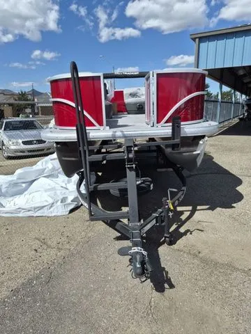 Slide: The Image of 2026 Sun Tracker Party Barge 16 DLX on trailer, red design. - 4