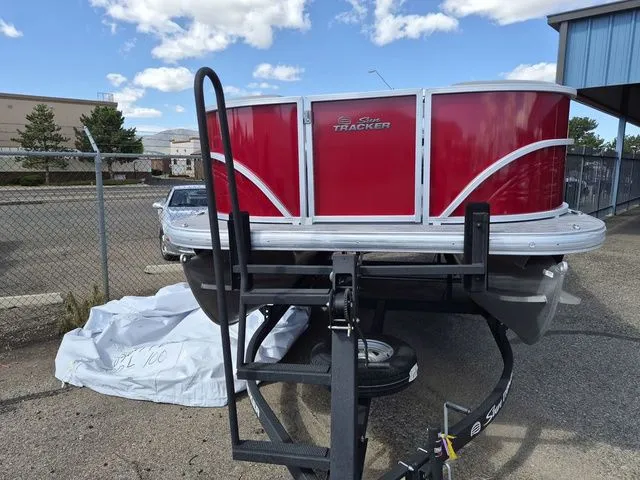 Slide: The Image of 2026 Sun Tracker Party Barge 16 DLX on trailer, red design. - 5