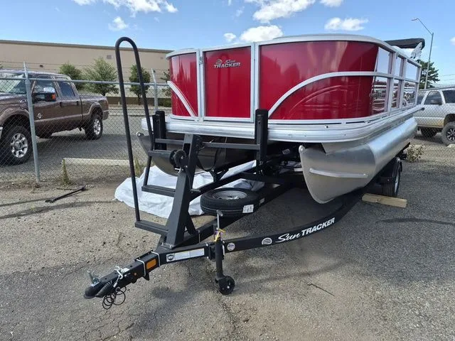 Slide: The Image of 2026 Sun Tracker Party Barge 16 DLX pontoon boat on trailer. - 6