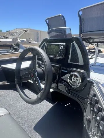 Slide: The Image of 2026 Xpress Boats HYPER-LIFT H18C dashboard with steering wheel. - 14