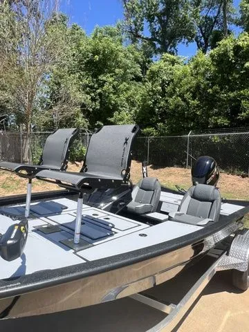 Slide: The Image of 2026 Xpress Boats HYPER-LIFT H18C on trailer, parked outdoors. - 4