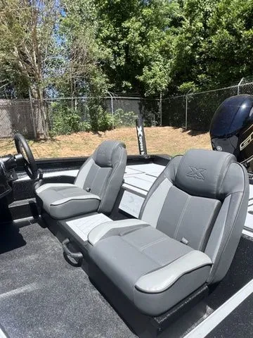 Slide: The Image of 2026 Xpress Boats HYPER-LIFT H18C interior with gray seats. - 7