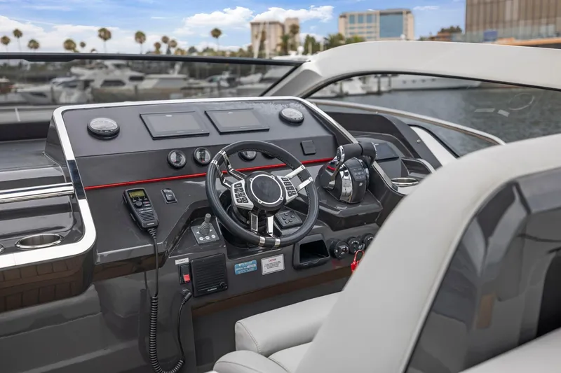 Slide: The Image of 2023 Fairline F//Line 33 Outboard helm with modern controls and navigation displays. - 37