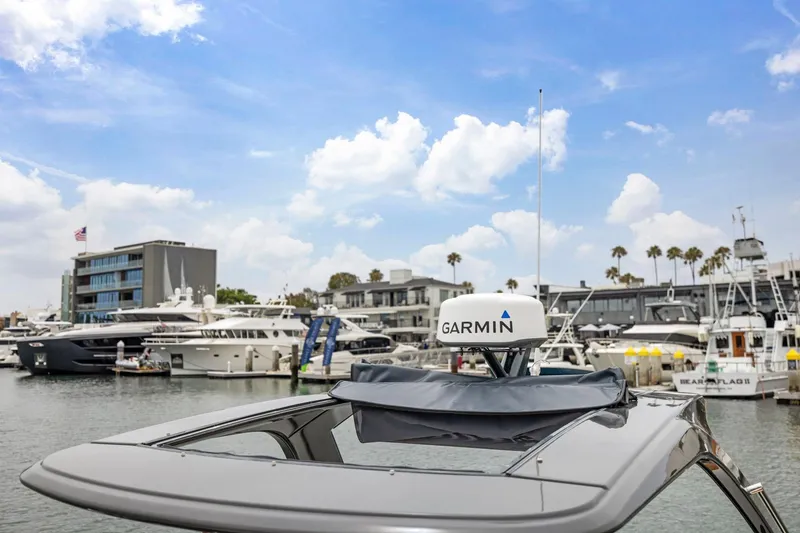 Slide: The Image of 2023 Fairline F//Line 33 Outboard with Garmin radar in a marina setting. - 41