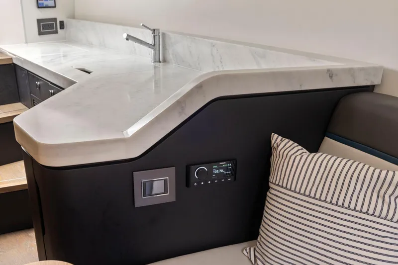 Slide: The Image of Luxurious interior of 2023 Fairline F//Line 33 Outboard with sleek countertop and modern design. - 54