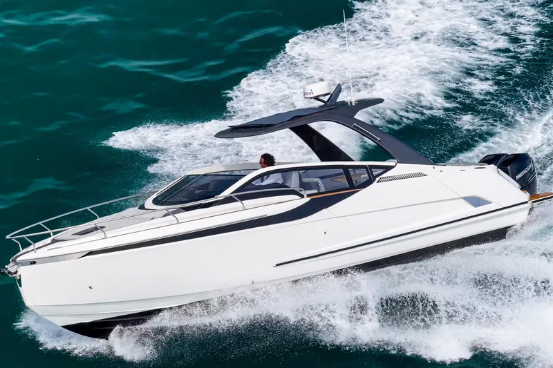 Slide: The Image of 2023 Fairline F//Line 33 Outboard cruising on open water, showcasing sleek design and performance. - 6