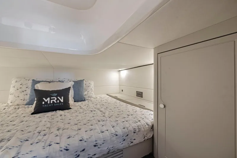 Slide: The Image of 2023 Fairline F//Line 33 Outboard cabin interior with cozy bed and modern design. - 63